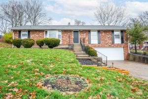 a brick house with a white garage at The Terrace Timber House For 8 in Hamilton