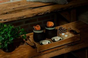 a wooden box filled with sushi and candles on a table at The Tribe Nimman Boutique Hotel in Chiang Mai