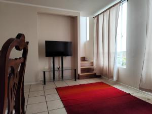 Et tv og/eller underholdning på Departamento Duplex 3 dormitorios , 3 baños