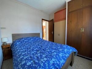 Postel nebo postele na pokoji v ubytování Casa con Jardín, Barbacoa y Aire Acondicionado en Zona Tranquila de L'Escala - HISP-7-15