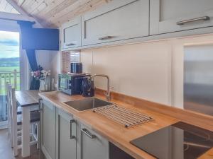 a kitchen with a sink and a counter top at Tyan - Uk49354 in Gatebeck