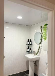 a bathroom with a sink and a mirror at Spacious 2BR Apartment near Subway Free Parking Seoul in Seoul +31 photos