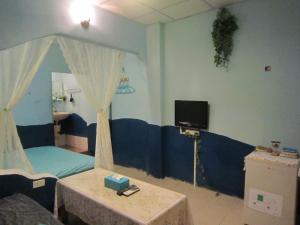 TV a/nebo společenská místnost v ubytování Wangyuku B&B