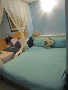 Postel nebo postele na pokoji v ubytování Wangyuku B&B