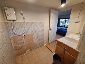 a bathroom with a shower and a sink and a mirror at So Good in Pai +78 photos