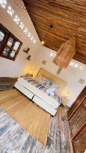 En eller flere senge i et værelse på Puerto idilio beach resort