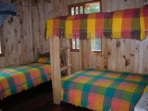 Postel nebo postele na pokoji v ubytování Centro de Aclimatizacion La Casa de Simon Lodge