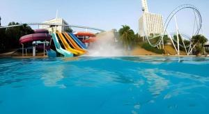 a water park with a water slide and a roller coaster at Sea Beach Koh Larn 1 in Ko Larn