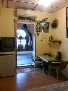 TV a/nebo společenská místnost v ubytování Wangyuku B&B