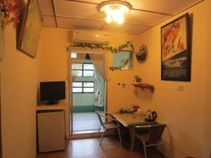 TV a/nebo společenská místnost v ubytování Wangyuku B&B