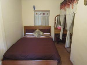 Postel nebo postele na pokoji v ubytování Wangyuku B&B