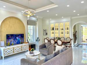 a living room with a couch and a table at Villa Giọt Nắng Phan Thiết in Phan Thiet