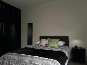 En eller flere senge i et værelse på Casa en Renta