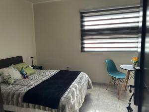 En eller flere senge i et værelse på Casa en Renta