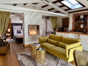 a living room with a couch and a fireplace at MURANO Suites - Venezia in Murano