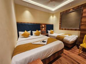 Postel nebo postele na pokoji v ubytování Hotel Imperial Suite