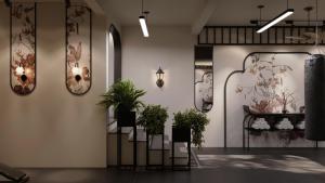 a room with plants and mirrors on the wall at Light Vesper Premium Hotel & Sky Bar in Ho Chi Minh City