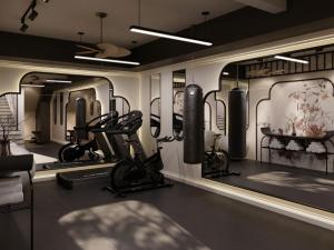 a gym with lots of equipment in a room at Light Vesper Premium Hotel & Sky Bar in Ho Chi Minh City +58 photos