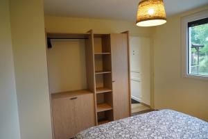 En eller flere senge i et værelse på Cottage - La Petite Chaumière