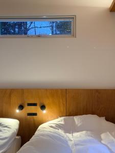 Postel nebo postele na pokoji v ubytování 雪箱神楽