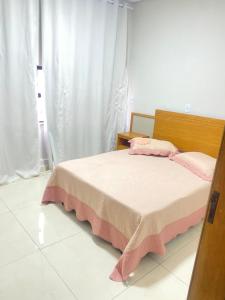 En eller flere senge i et værelse på Coimbra House