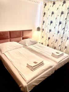 Ένα ή περισσότερα κρεβάτια σε δωμάτιο στο K&B Residence