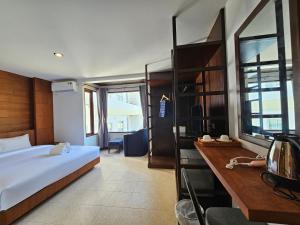 Giường trong phòng chung tại Anda See Hotel +9 ảnh