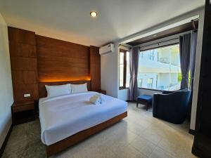 Giường trong phòng chung tại Anda See Hotel
