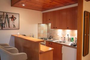 a kitchen with a sink and a counter top at Pied de piste et à 5min des Bains d'Hérémence in Vex