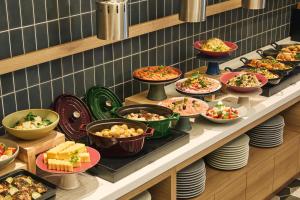 a buffet line with many different types of food at Premium hotel MONday MAIHAMA View 1 in Tokyo