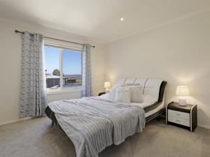 En eller flere senge i et værelse på The Peninsula Panorama