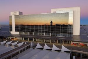 a large building with a lot of windows at Grand Hyatt DFW Airport in Irving