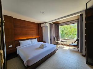 Ένα ή περισσότερα κρεβάτια σε δωμάτιο στο Anda See Hotel