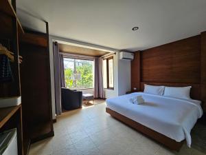 Ένα ή περισσότερα κρεβάτια σε δωμάτιο στο Anda See Hotel +18 φωτογραφίες