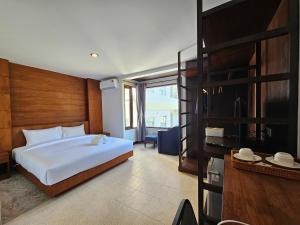 Ένα ή περισσότερα κρεβάτια σε δωμάτιο στο Anda See Hotel