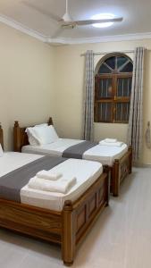 Postel nebo postele na pokoji v ubytování Roots