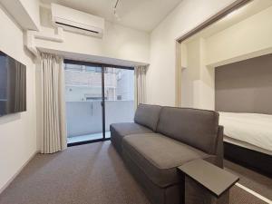 TV a/nebo společenská místnost v ubytování Living like Hotel 博多駅前