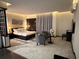 Postel nebo postele na pokoji v ubytování ايوان التميز للشقق الفندقية- Ewan Altamayoz Hotel Apartment + 74 fotografií