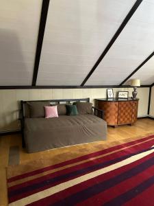 a bedroom with a large bed and a table at Leonovs in Almaty