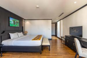 TV a/nebo společenská místnost v ubytování Aaron Riverview Hotel