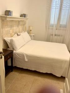 Postel nebo postele na pokoji v ubytování Borgo Rosso Terra