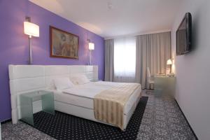 Postel nebo postele na pokoji v ubytování Hotel Phoenix