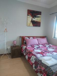 En eller flere senge i et værelse på Premium Getaway @ la Bella Costa