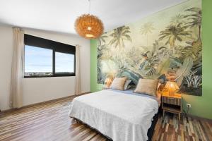 Postel nebo postele na pokoji v ubytování La Villa des Sables Noirs - L'Étang Salé + 21 fotografií