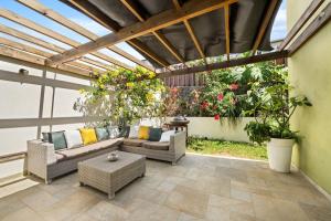 Posezení v ubytování La Villa des Sables Noirs - L'Étang Salé