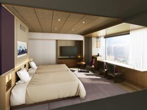 a bedroom with a large bed and a television at Shoho in Matsumoto