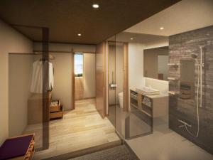 a bathroom with a shower and a toilet and a sink at Shoho in Matsumoto