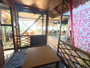 a room with a wooden bench in a building at Monsoon in Agonda