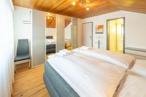 En eller flere senge i et værelse på Penthouse Matterhorn Vista