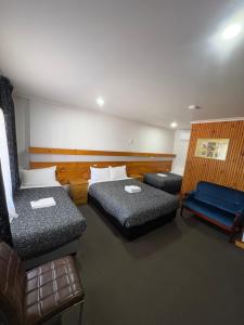 Postel nebo postele na pokoji v ubytování Majestic Motel